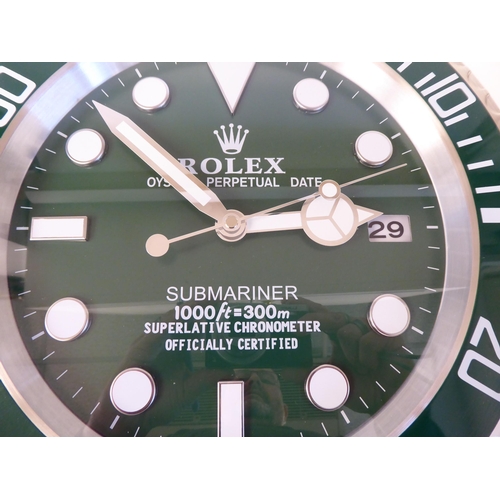 61 - A dealer display advertising wall timepiece for Rolex Oyster Perpetual; the movement faced by a bato... 