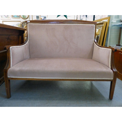 63 - An Edwardian bone inlaid, mahogany showwood framed two person, enclosed settee, raised on square, ta... 