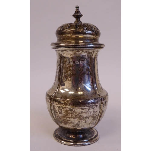 66 - A silver caster of baluster form, on a pedestal foot  London 1925  6.5