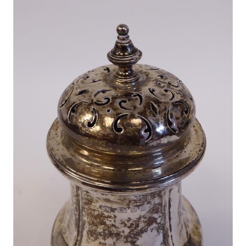 66 - A silver caster of baluster form, on a pedestal foot  London 1925  6.5