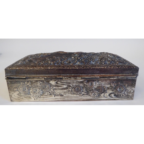 69 - A silver plated jewellery box, decorated in relief with flowers and birds  7.25