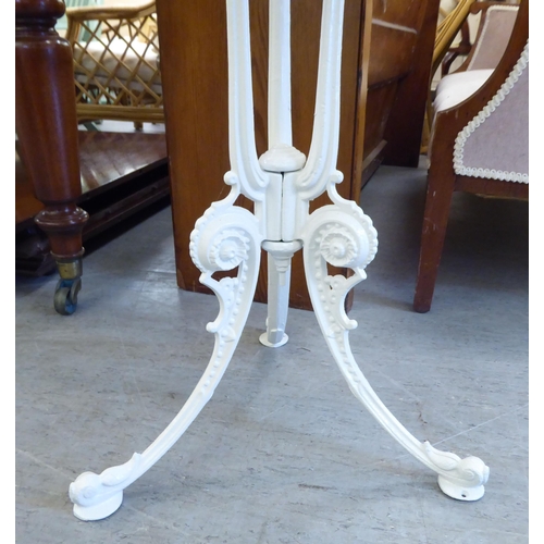 7 - A Victorian style white painted, cast iron pub style table with a marble top  28