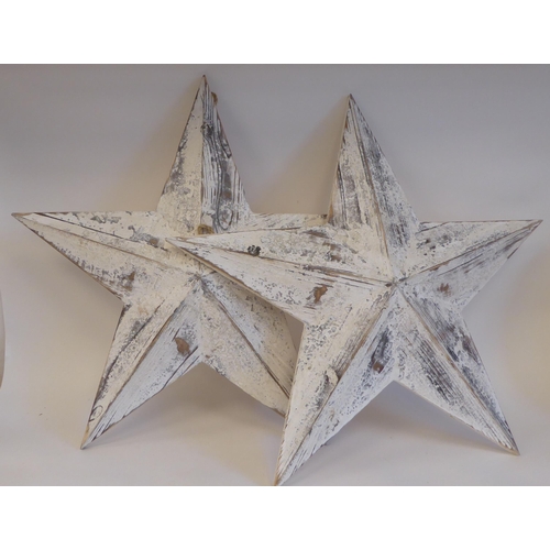 78 - A pair of white painted wooden barn stars  each 21