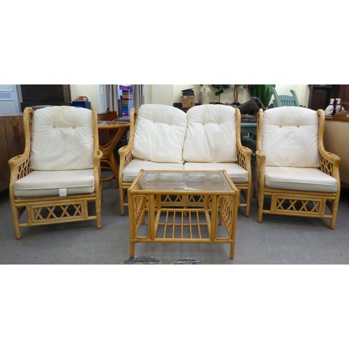 8 - A caned and bamboo conservatory suite  comprising a two person settee, a pair of armchairs and a cof... 