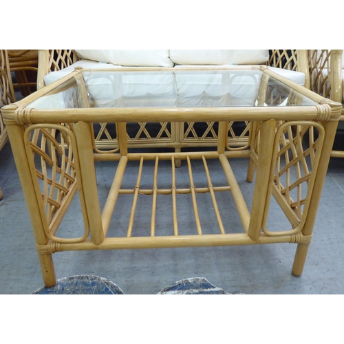 8 - A caned and bamboo conservatory suite  comprising a two person settee, a pair of armchairs and a cof... 