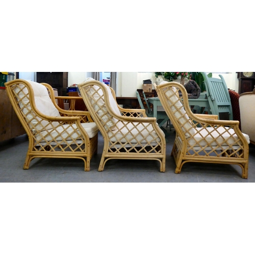 8 - A caned and bamboo conservatory suite  comprising a two person settee, a pair of armchairs and a cof... 