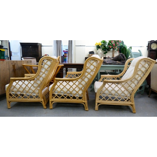 8 - A caned and bamboo conservatory suite  comprising a two person settee, a pair of armchairs and a cof... 