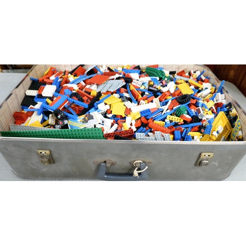 81 - A suitcase of Lego components; and circa 1980s Lego ephemera