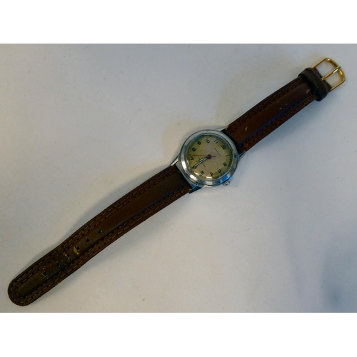 92 - A vintage Paul Buhre stainless steel cased wristwatch from Garrard & Co, with a second hand, fac... 