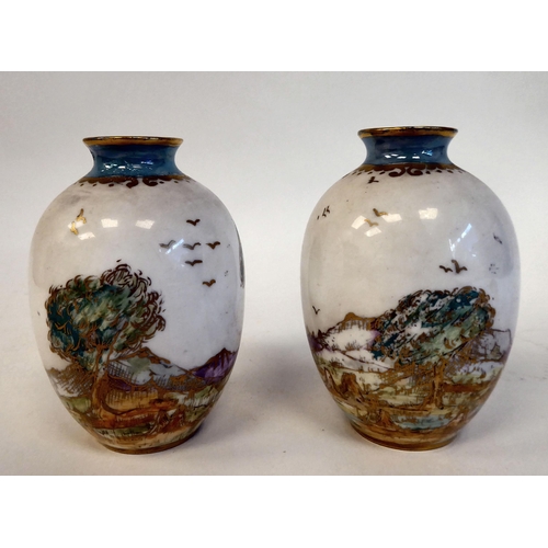 99 - A pair of Royal Doulton china miniature baluster shape vases, decorated in part lustre glazed landsc... 