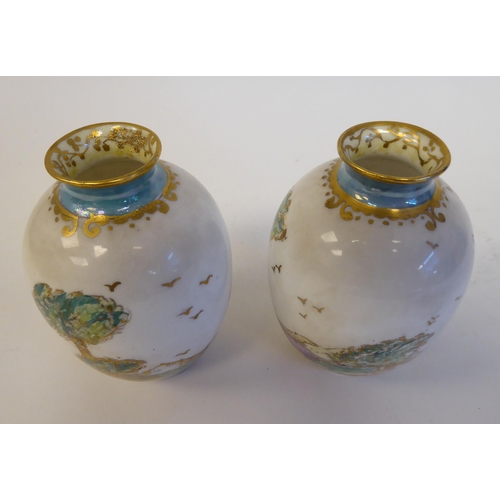 99 - A pair of Royal Doulton china miniature baluster shape vases, decorated in part lustre glazed landsc... 