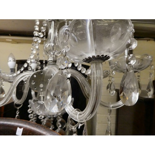 155 - A modern crystal chandelier with six scrolled branches, trailing pendants and beads  24