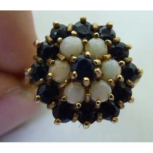 295 - A 9ct gold sapphire and opal cluster ring