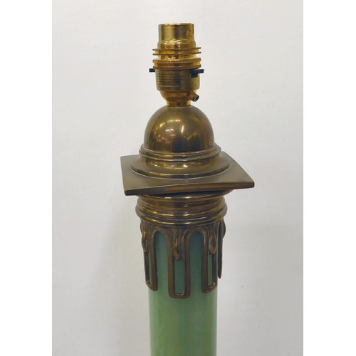 44 - An early 20thC brass table lamp incorporating an opaque, pale green glass column, on a stepped, squa... 