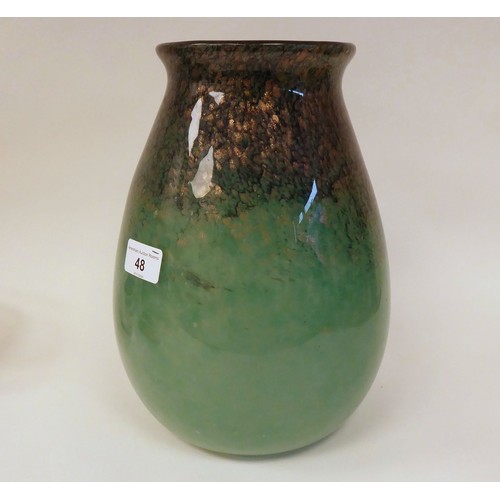 48 - A Moncrieff Monart glass vase of tapered, bulbous form with a flared rim, decorated in opaque green ... 