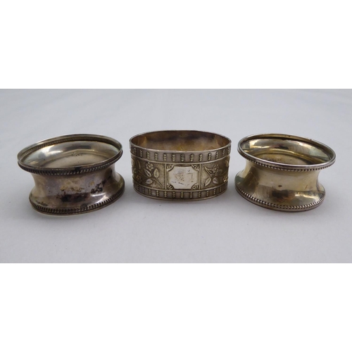 1 - Silver items, viz. seven dissimilar napkin rings; and a presentation spoon  mixed marks