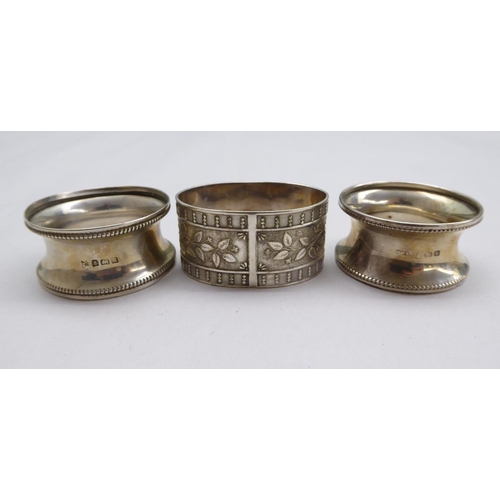 1 - Silver items, viz. seven dissimilar napkin rings; and a presentation spoon  mixed marks