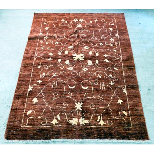 116 - A Ziegler design rug, decorated with trailing floral patterns, on a red ground  71