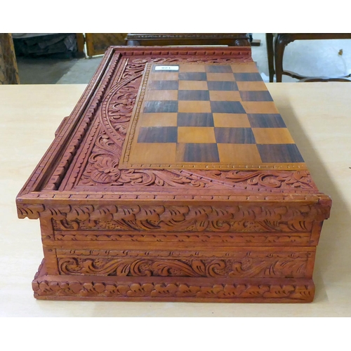 128 - An Indian carved hardwood, folding chess board/backgammon set  21