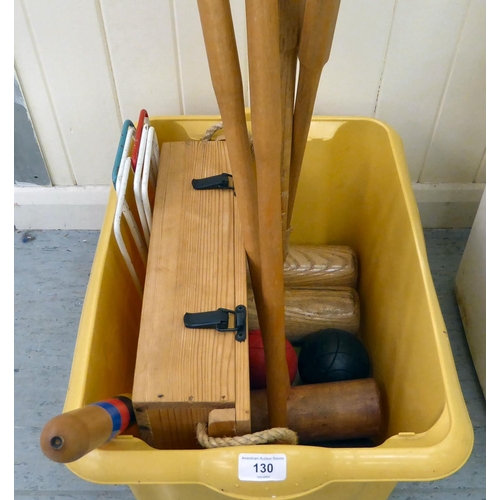 130 - Croquet items, comprising mallets, hoops and balls