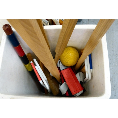 130 - Croquet items, comprising mallets, hoops and balls