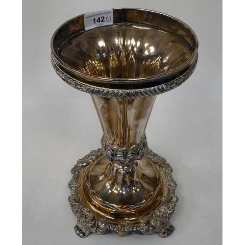 142 - A 20thC silver plated table centrepiece, fashioned as a tapered vase, on a C-scroll and foliage cast... 