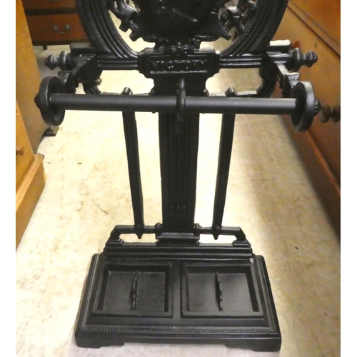 156 - A reproduction of a Victorian black painted cast iron stickstand  35