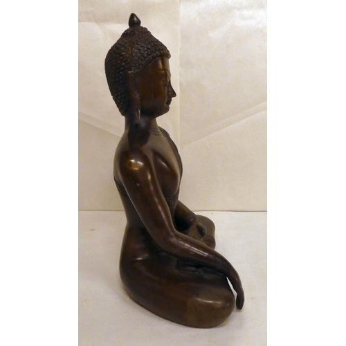 161 - A modern bronze, a seated Buddha  12