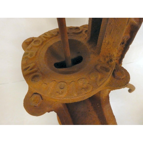 168 - A rust coloured cast iron replica of a 19thC water pump head  21