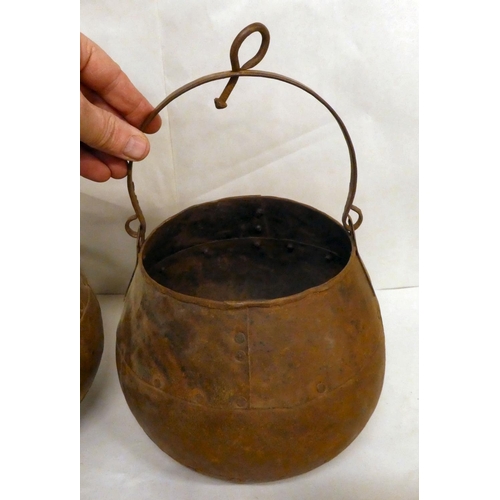 175 - A pair of rivetted cast metal hanging cooking pots  7