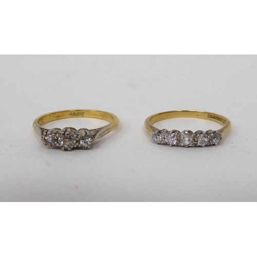 182 - A 15ct gold and platinum three stone diamond ring; and an 18ct gold and platinum five stone diamond ... 