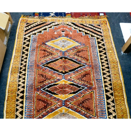 20 - Rugs: to include a Kelim with stylised motifs, on a multi-coloured ground  76