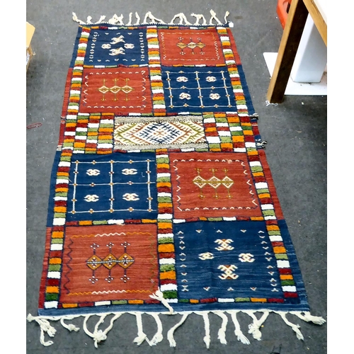 20 - Rugs: to include a Kelim with stylised motifs, on a multi-coloured ground  76