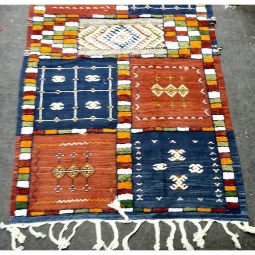 20 - Rugs: to include a Kelim with stylised motifs, on a multi-coloured ground  76