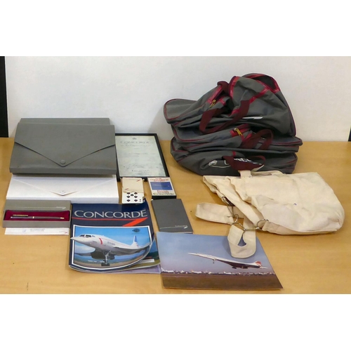 213 - Concorde related collectables: to include playing cards; a pen  boxed; and various bags