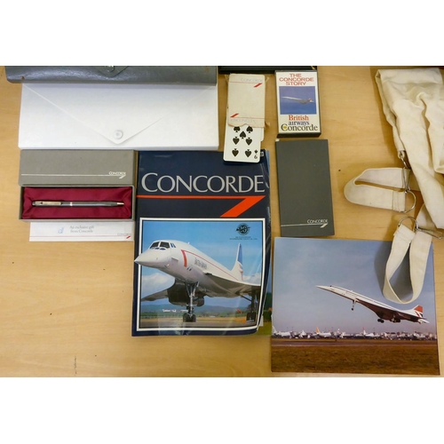 213 - Concorde related collectables: to include playing cards; a pen  boxed; and various bags