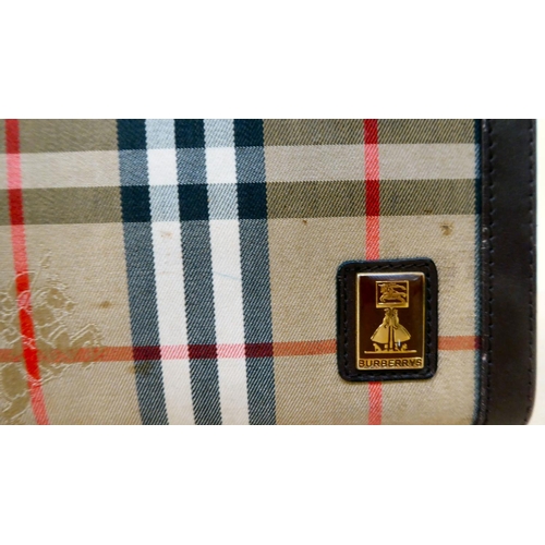 223 - A Gucci blue hide and fabric handbag, serial no.001.115.1366  with dust cover; and a Burberry vanity... 