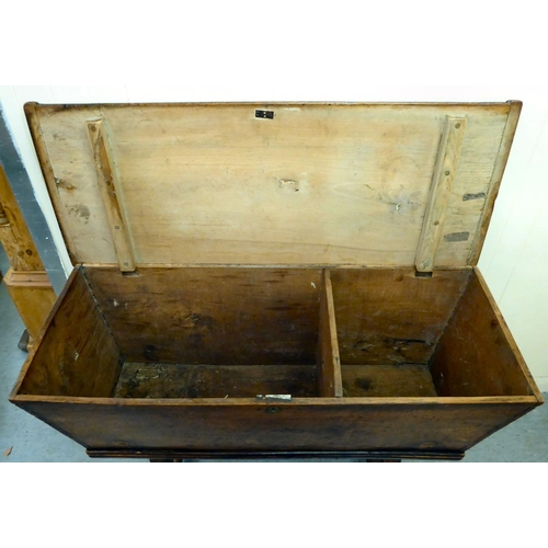 23 - A late 18th/early 19thC elm dough bin with angled sides and a removeable lid, raised on square legs&... 