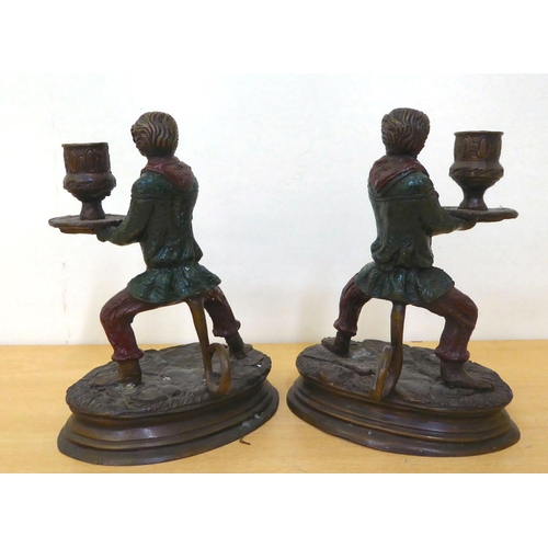 245 - A pair of modern cast bronze novelty candlesticks, fashioned as monkeys', in servant robes, on an ov... 