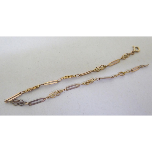 258 - Gold and yellow metal jewellery: to include a fine 9ct gold bar and hoop link chain