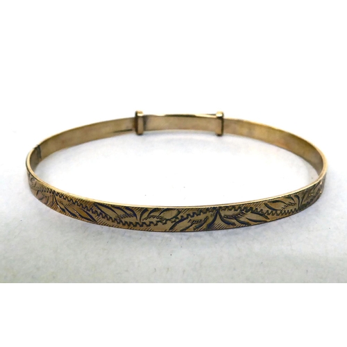 261 - A 9ct gold Christening bangle 