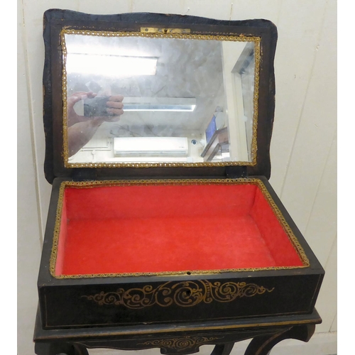 266 - A late Victorian chinoiserie design black lacquered sewing table, the hinged lid decorated with Orie... 