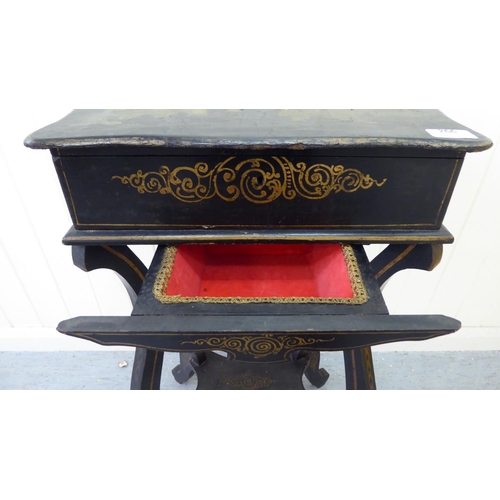 266 - A late Victorian chinoiserie design black lacquered sewing table, the hinged lid decorated with Orie... 