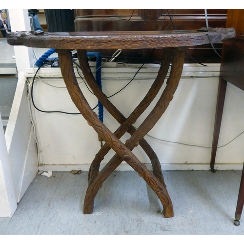 267 - A late 19thC carved Black Forest butler's tray with branch and leaf ornament, on a folding stand&nbs... 