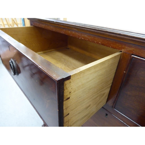 274 - A mid Victorian mahogany dressing chest, the two short/three graduated long drawers with brass ring ... 