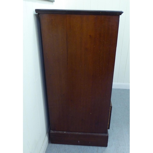 274 - A mid Victorian mahogany dressing chest, the two short/three graduated long drawers with brass ring ... 