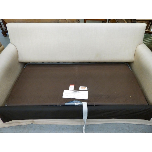 278 - A modern cream coloured, metal frame bed settee with a low back and scrolled arms and loose cushions... 