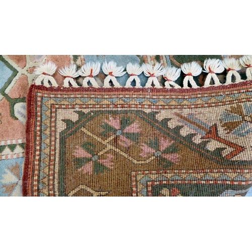 292 - An Oriental woollen rug, decorated with geometric designs, on a multi-coloured ground  76