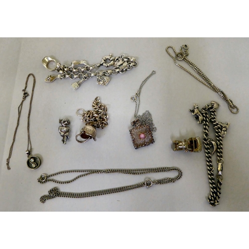 293 - Silver and white metal items of personal ornament: to include pendant charms  mixed marks