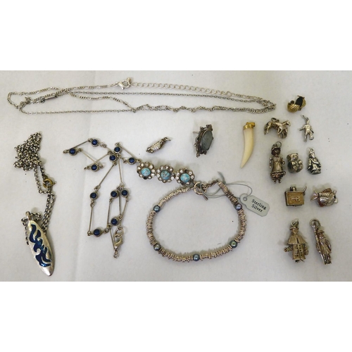 293 - Silver and white metal items of personal ornament: to include pendant charms  mixed marks